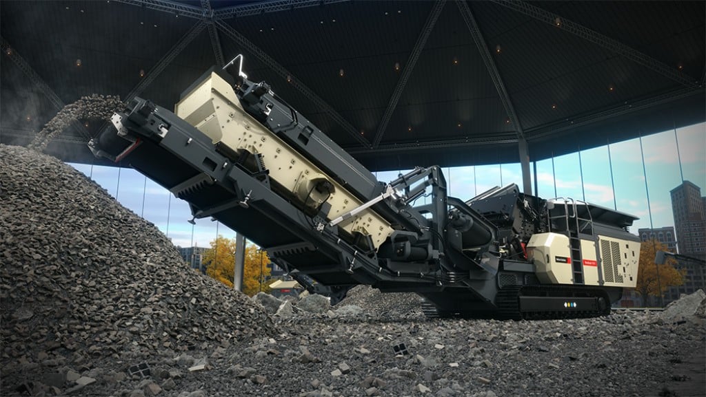 An impact crusher crushes material on a job site