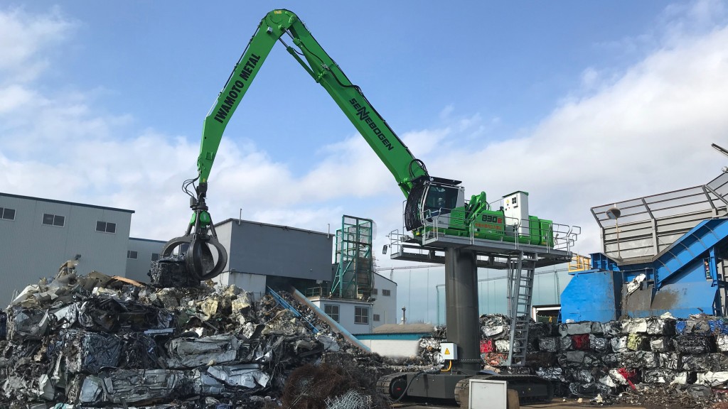 A material handler moves metal on the job site