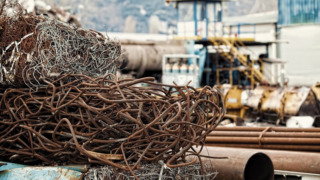 A pile of rusted scrap metal wire in a scrapyard