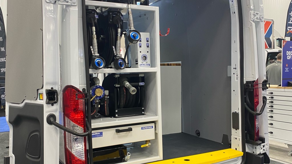 A service van with a workbench parked inside a building