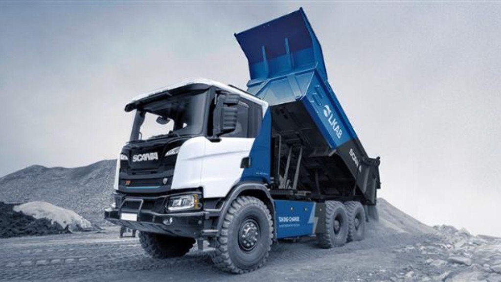 A heavy tipper unloads material on the job site
