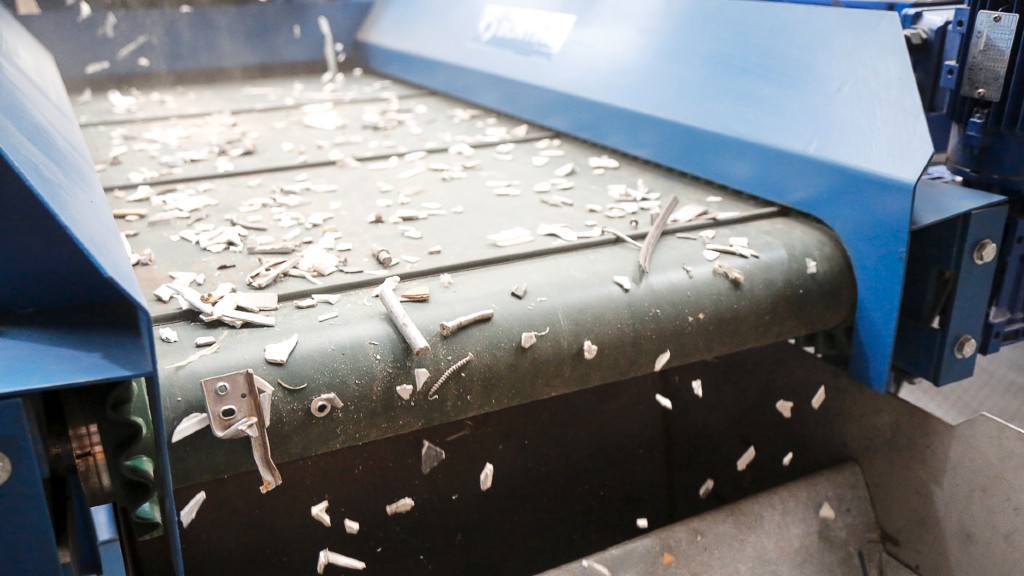 Stainless steel scraps travel off a conveyor