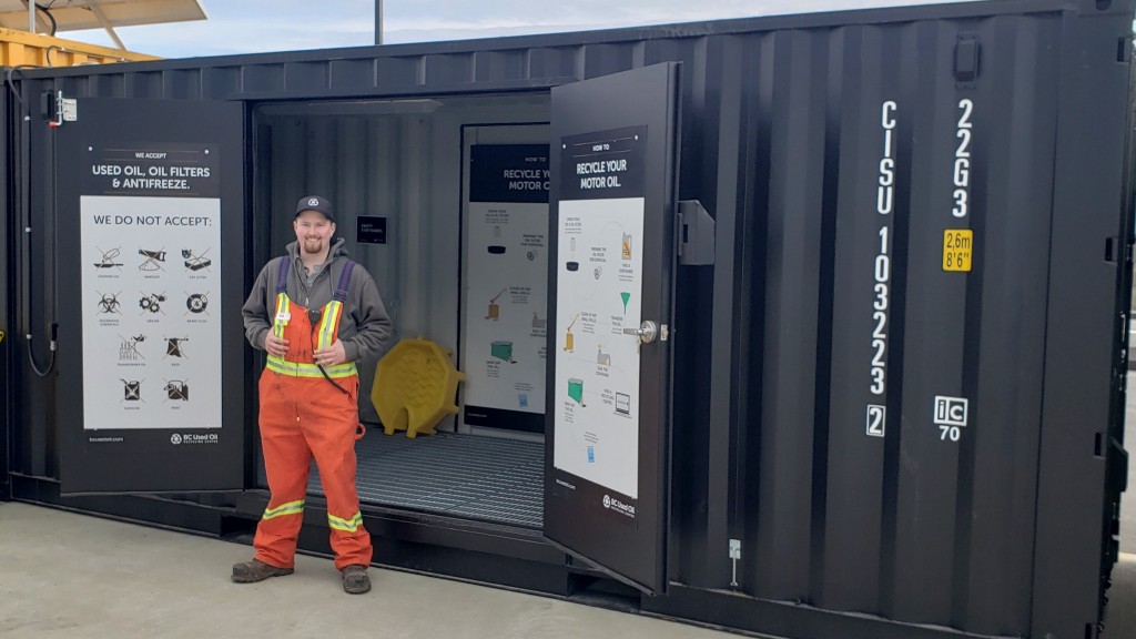 Somebody stands outside a used oil recycling centre