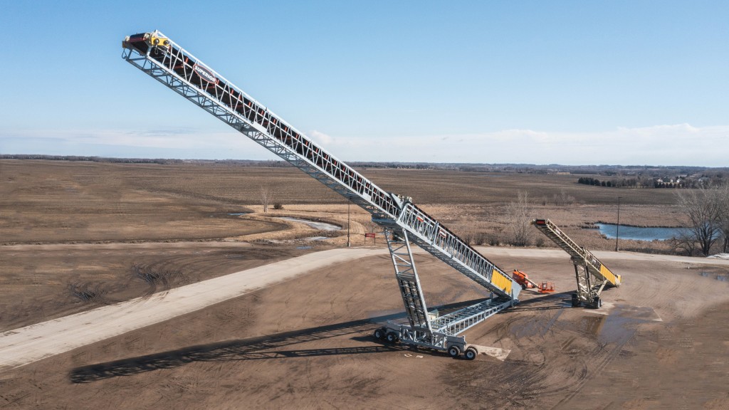 A conveyor is parked on a job site