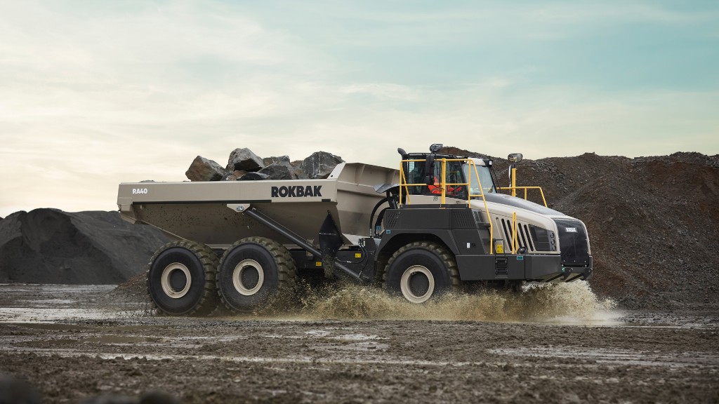 An artidulated hauler moves material in a job site