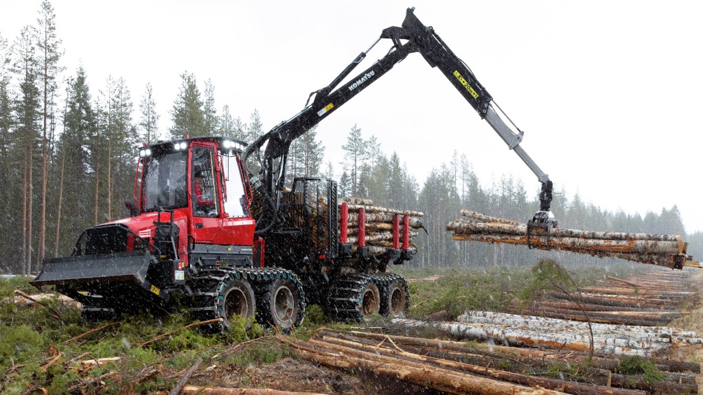 A forwarder collects logs on a job site