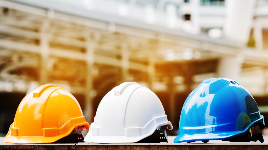 Several construction hats are lined up in a row