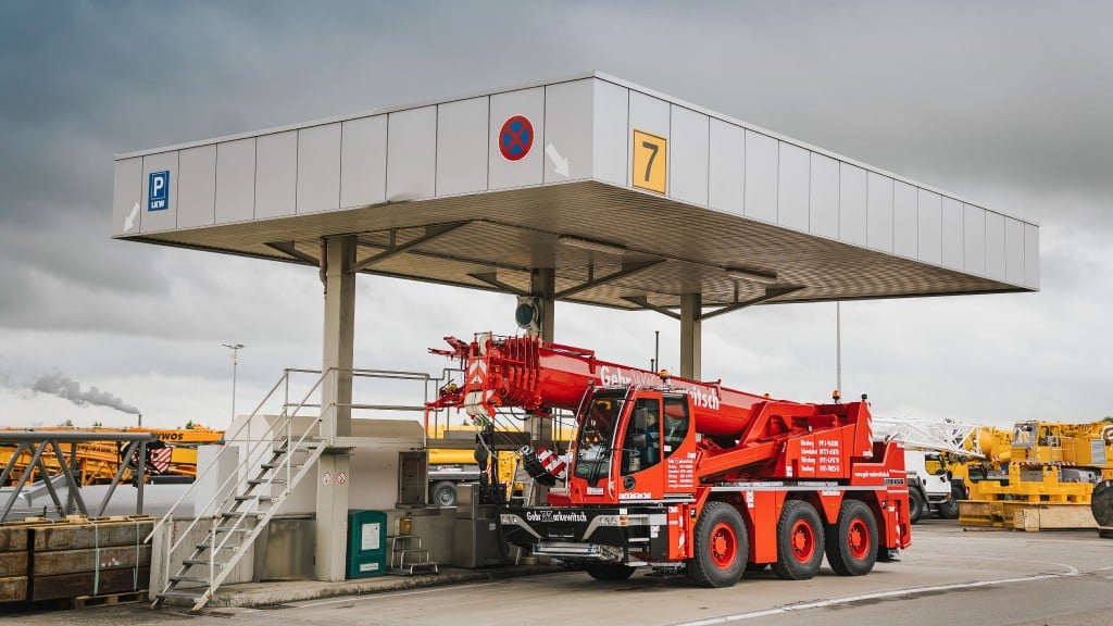 A crane fills up with HVO fuel at a filling station