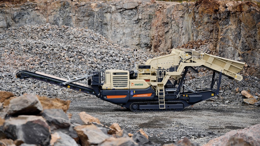 A mobile crusher is parked on a job site