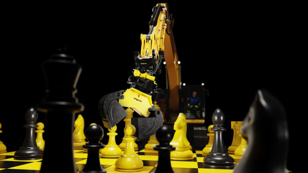 A tiltrotator-equipped excavator picks up a chess piece