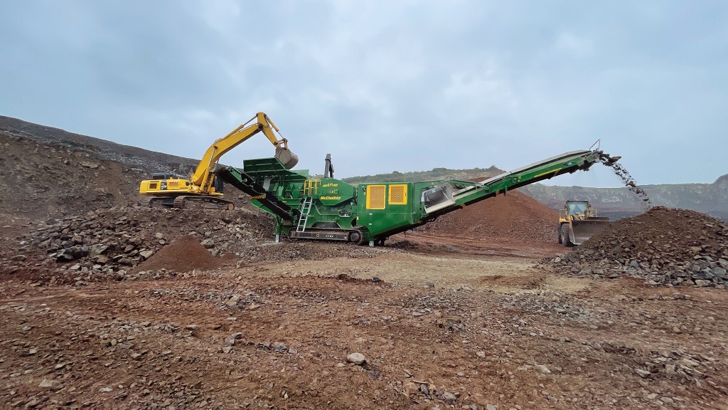 A crusher crushes rock on a job site