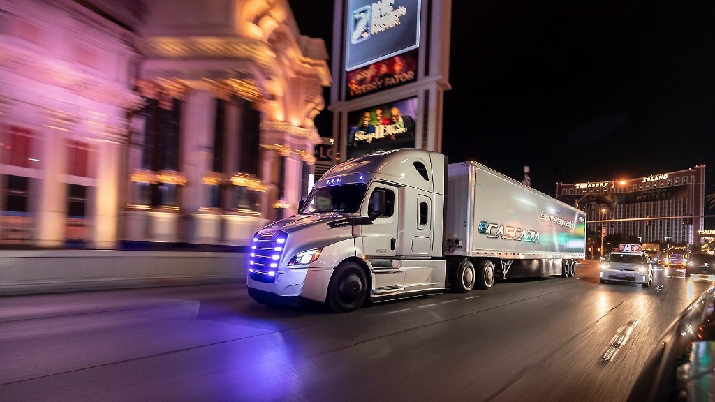 A truck drives down a busy road