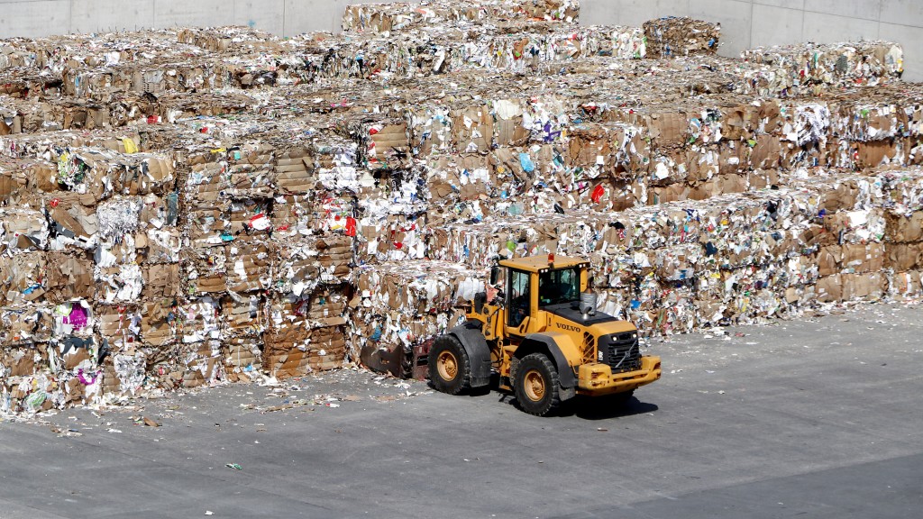 Bales of paper are being moved on a job site