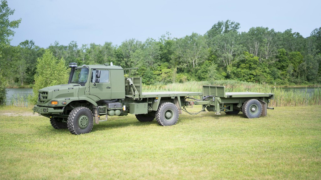 An off-road logistics vehicle parked in a field