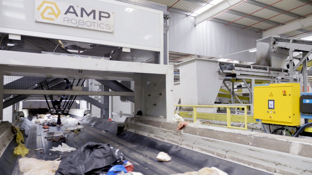 An AI robotic sorting machine sorts recyclables