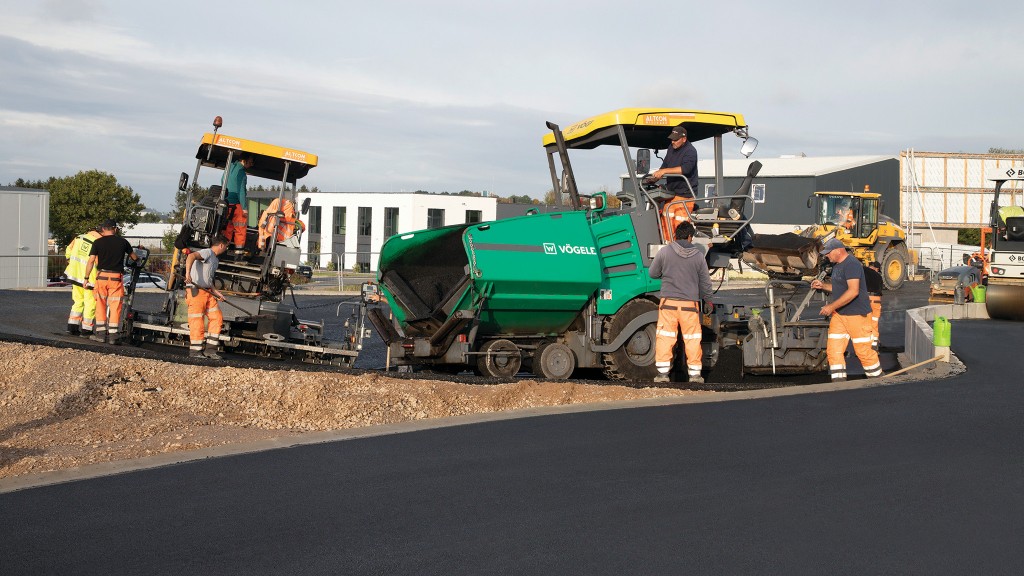 A paver paves a road