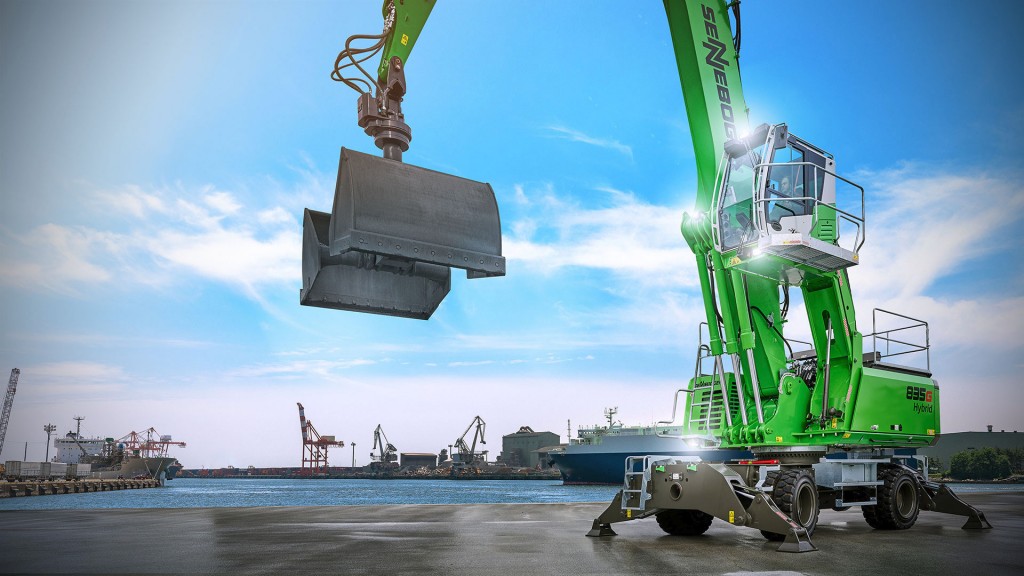 A material handler operates near a harbour