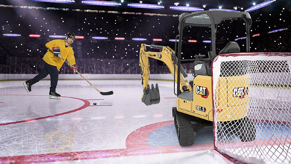 A hockey player shoots to score on an excavator goalie