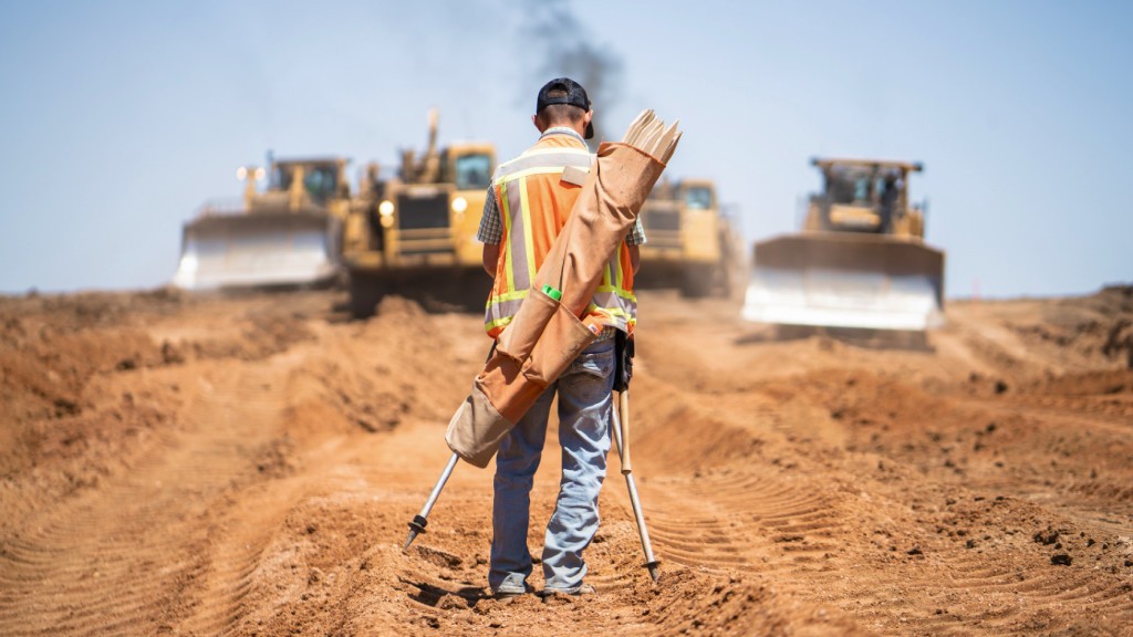 A worker walks through a job site