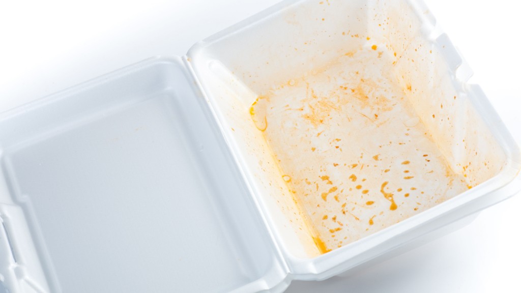 A piece of clamshell styrofoam food packaging is dirty