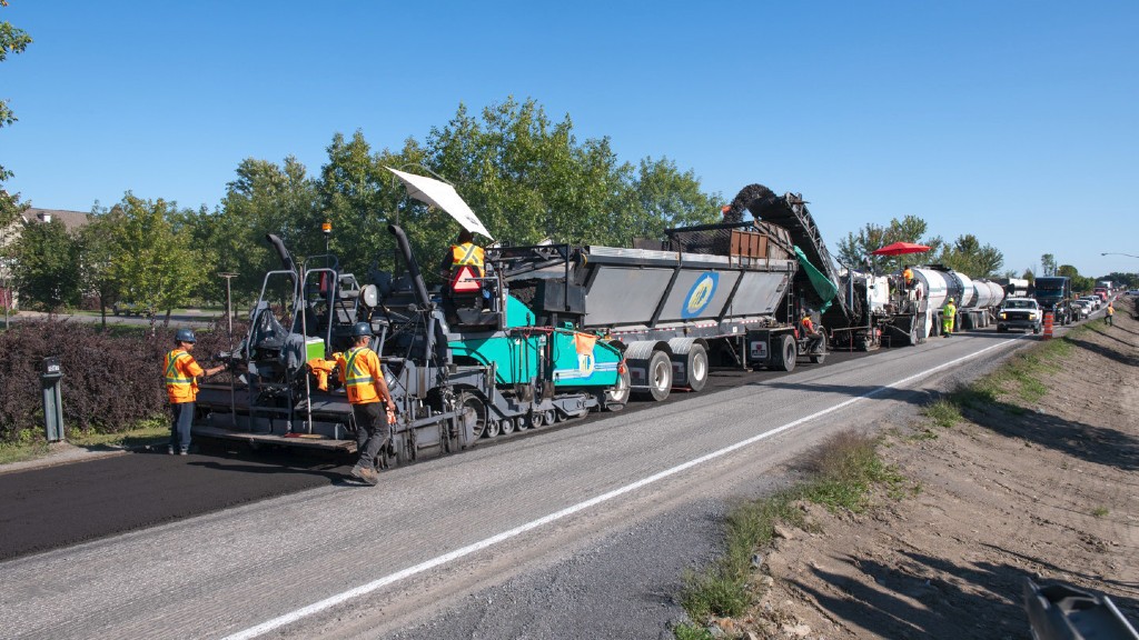 A roadbuilding crew operates on a sunny day