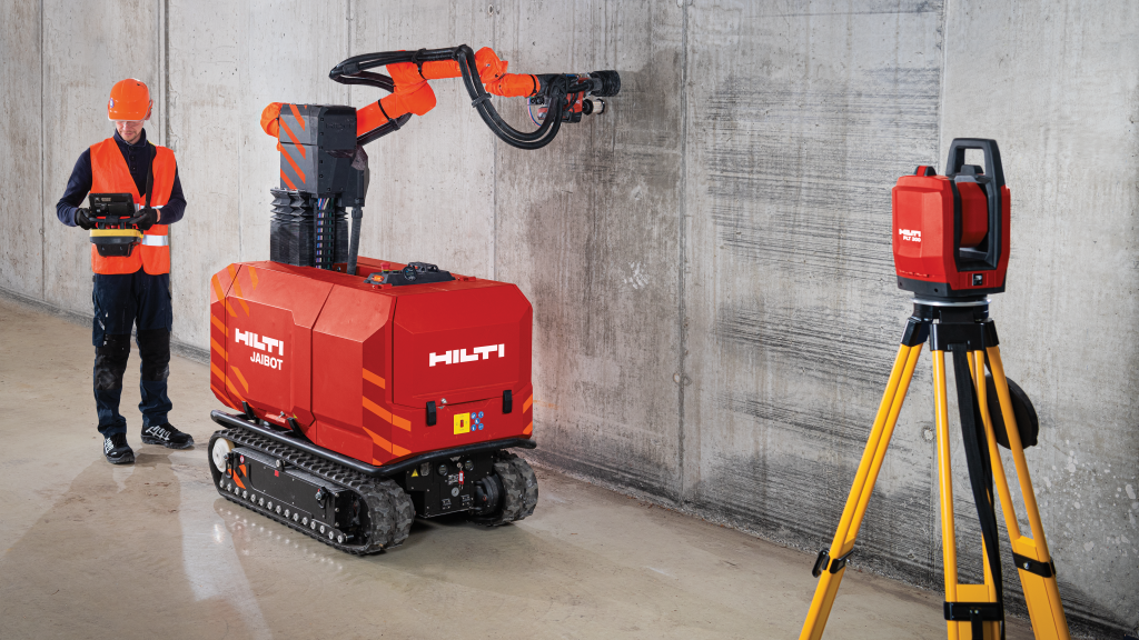 A drilling robot drills into a concrete wall
