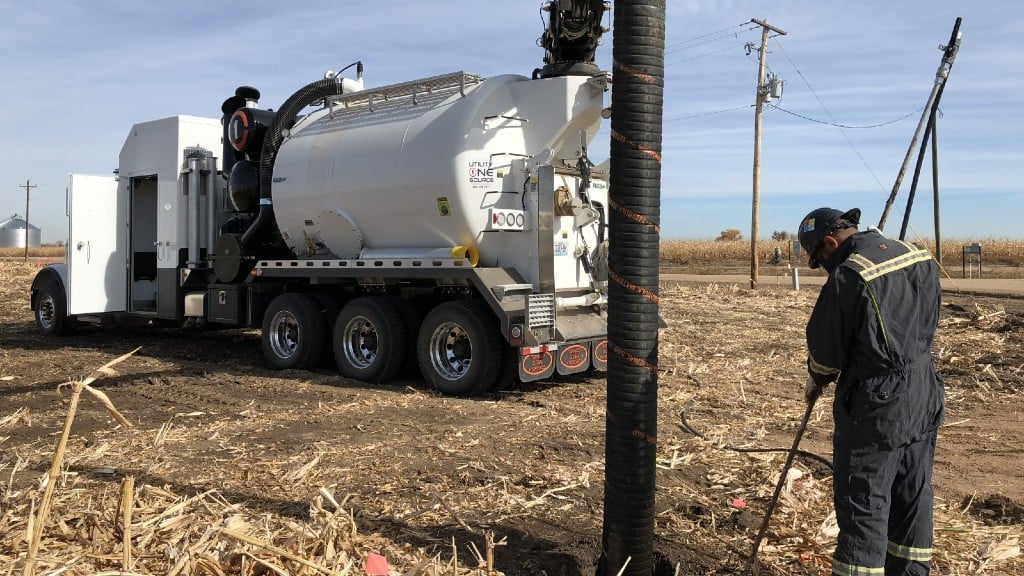 A hydrovac truck operates on a job site