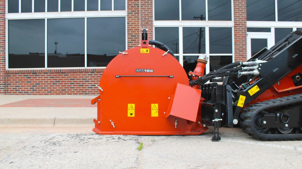 A microtrencher attachment on a sidewalk