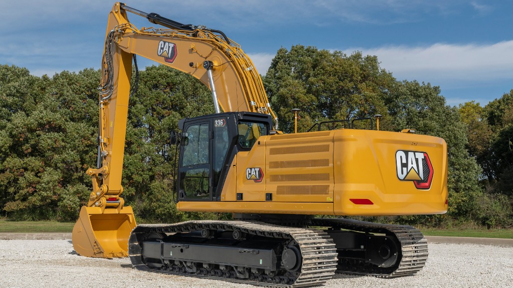 An excavator is parked on a layer of gravel