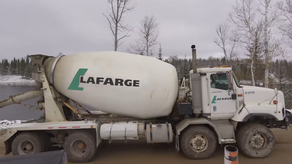 An asphalt truck operates on a job site