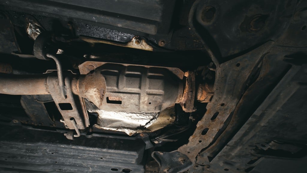 A close-up of a catalytic converter under a car