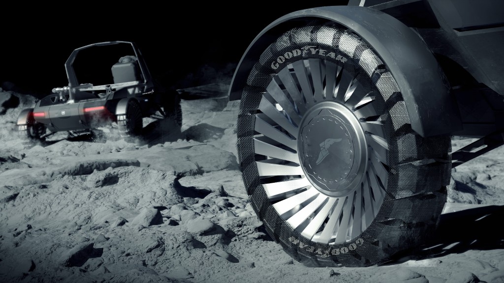 Two rovers travelling on the Moon.