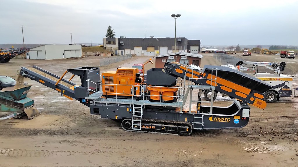 A cone crusher crushes material on a job site