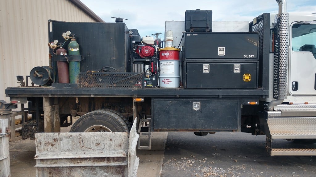 An air compressor sits in the middle of a truck