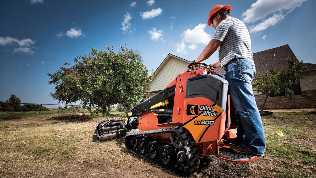 An operator uses a piece of Ditch Witch equipment on the job site
