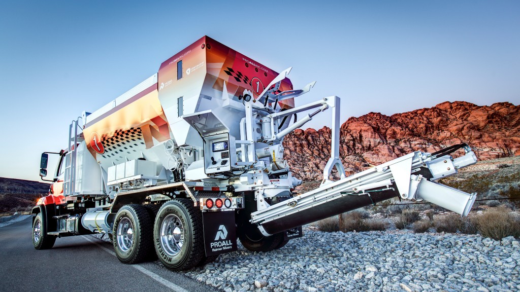 A concrete mixer parked on the side of the road