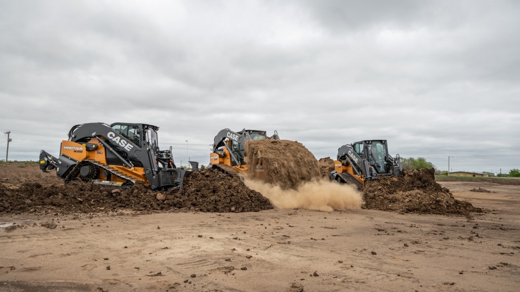 Several compact dozer loaders move dirt on a job site