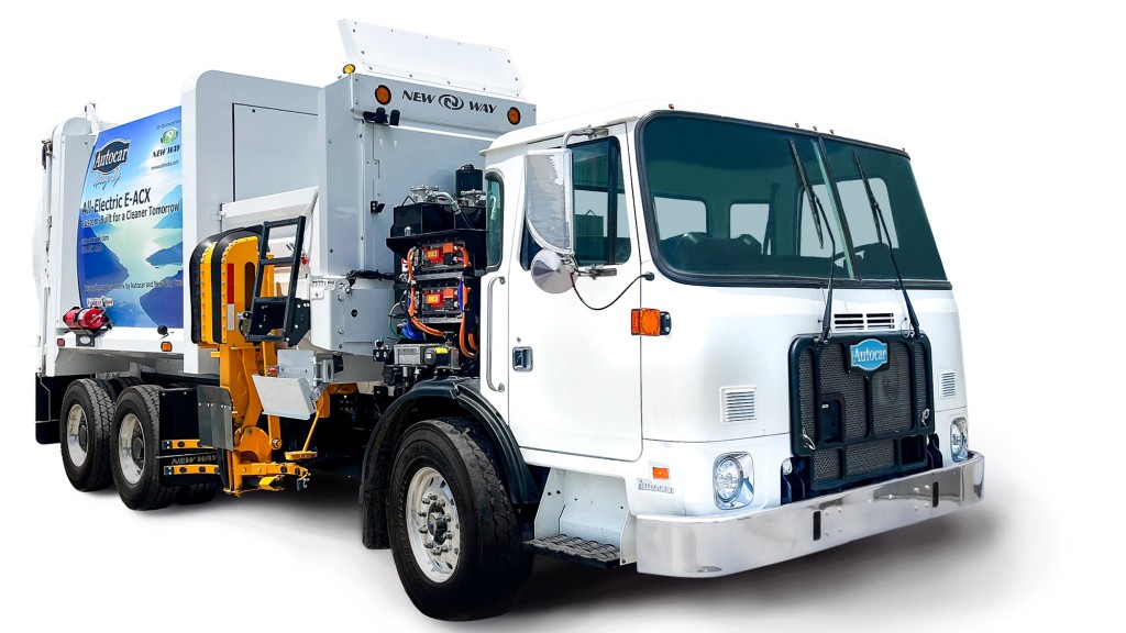 An Autocar cabover truck against a white background