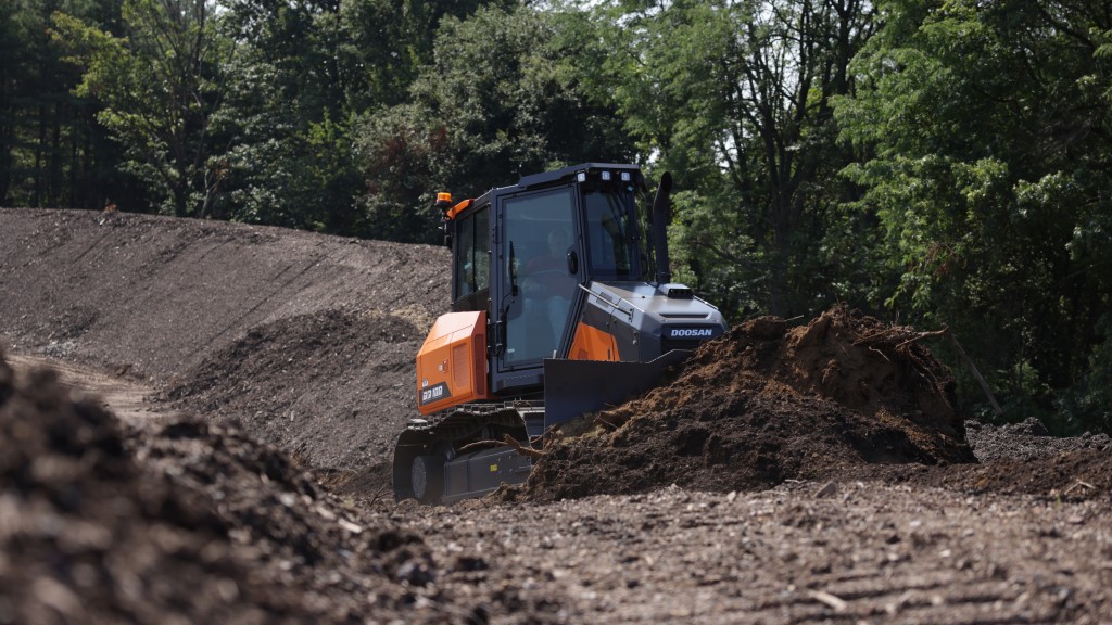 A dozer pushes dirt around on a job site