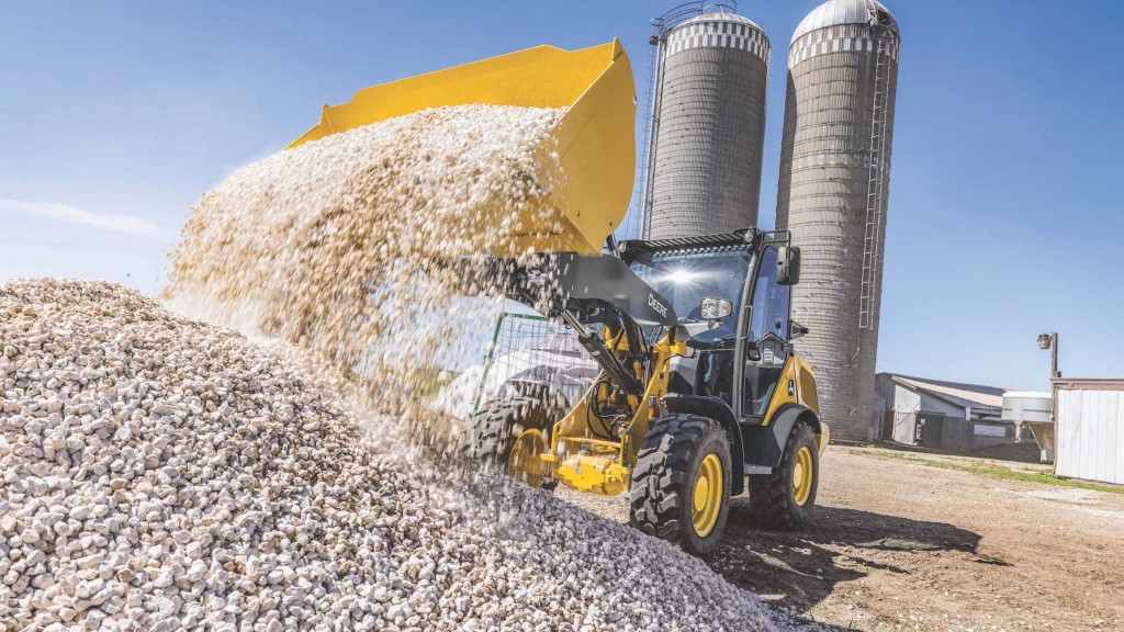 A wheel loader dumps rock material out of its bucket