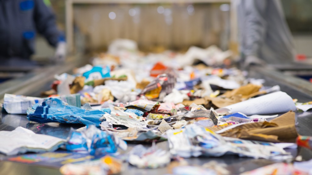 Paper materials travel down a conveyor