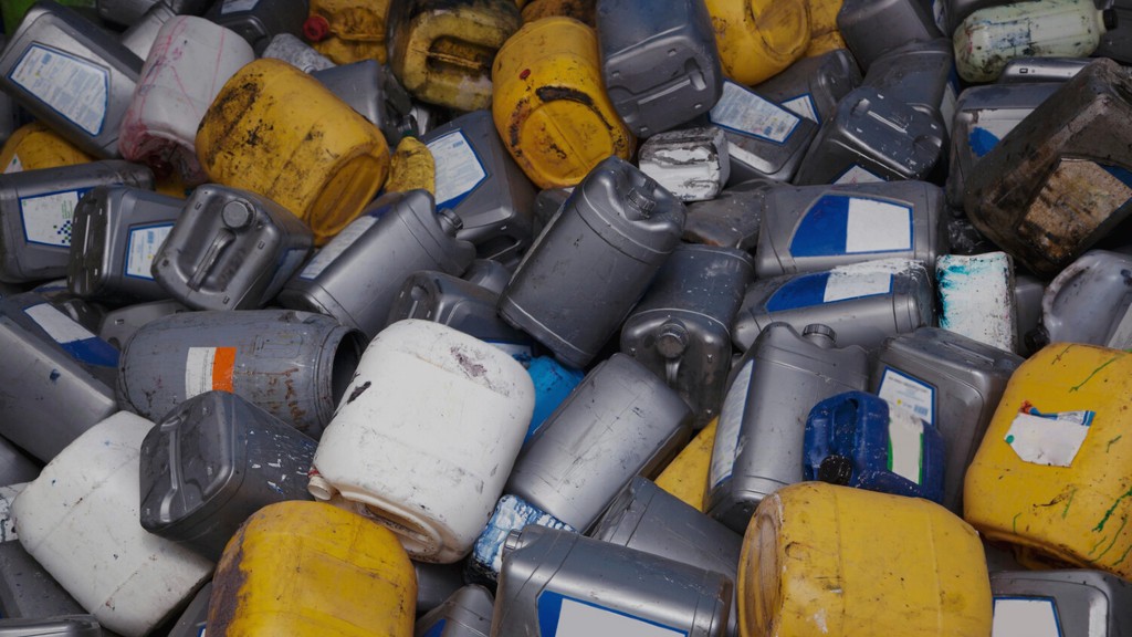A pile of engine oil plastic packaging containers