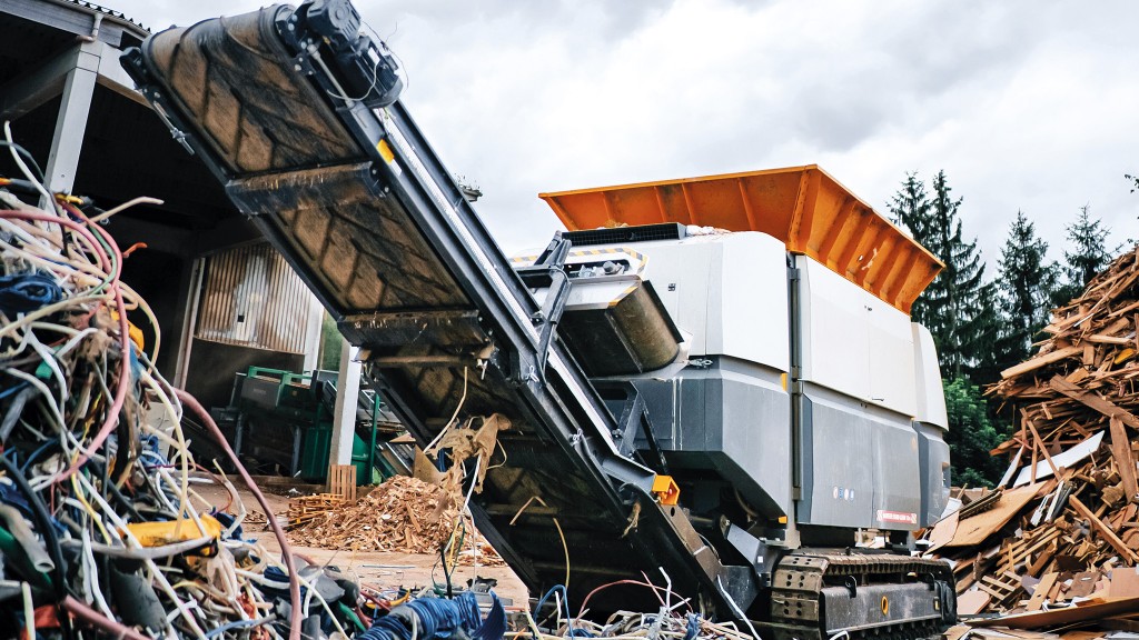 A pre-shredder shreds metal on a job site