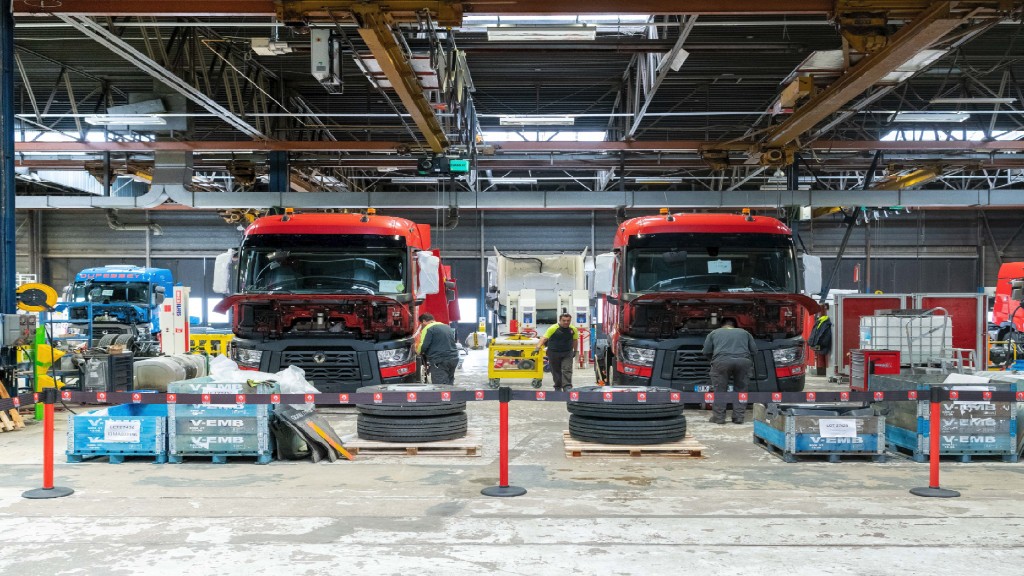 Trucks being disassembled in a facility