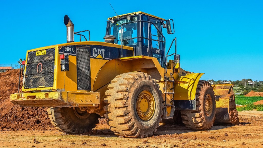 A wheel loader is parked on a job site