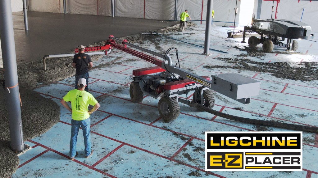 A concrete placer spreads concrete on a job site floor