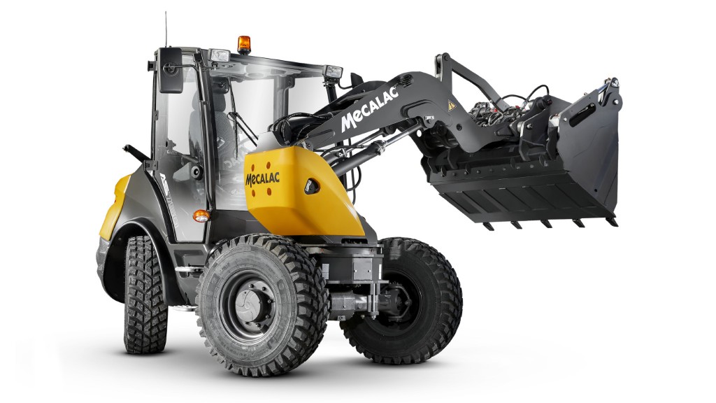 A swing loader is parked on a white background