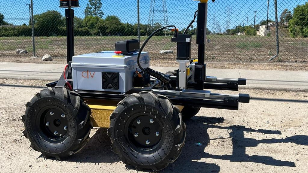 An autonomous surveying vehicle drives down a road