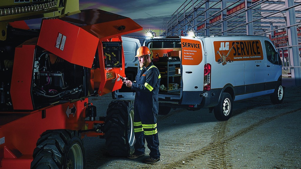 A service technician downloads data from a machine