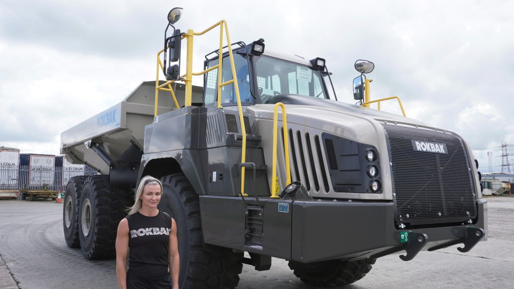 Ali Crawford stands beside a hauler